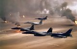 USAF aircraft of the 4th Fighter Wing (F-16, F-15C and F-15E) fly over Kuwaiti oil fires, set by the retreating Iraqi army during Operation Desert Storm in 1991.<br/><br/>

The Persian Gulf War (August 2, 1990 – February 28, 1991), commonly referred to as simply the Gulf War, was a war waged by a U.N.-authorized coalition force from thirty-four nations led by the United States, against Iraq in response to Iraq's invasion and annexation of the State of Kuwait.<br/><br/>

This war is commonly known as Operation Desert Storm, the First Gulf War, Gulf War I, or the Iraq War.